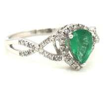 14kt White gold 0.65ct pear shaped emerald and 0.25ctw diamond infinity ring