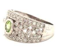 14kt White gold bezel set oval peridot and diamond flower Inspired milgrain ring