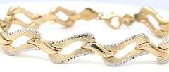 14kt Two tone gold diamond cut woven link bracelet