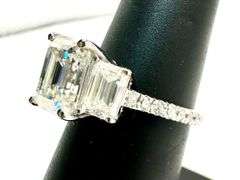 Sparkling 5.5 Ctw 3 Stone Emerald Cut Ice White Moissanite Ring