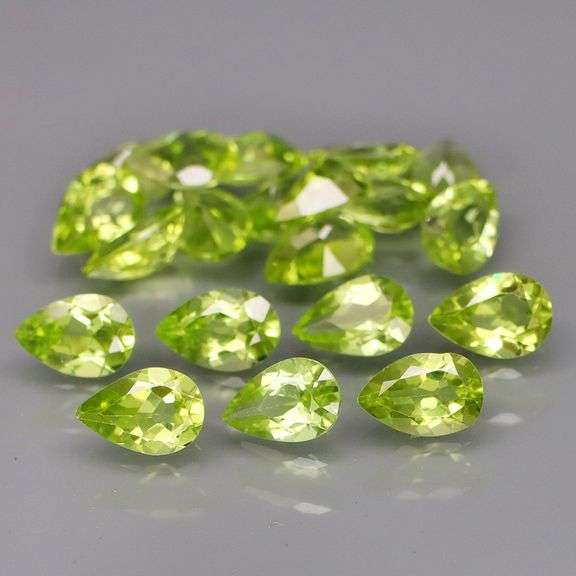 Dazzling 8.32ct untreated apple green Peridot set