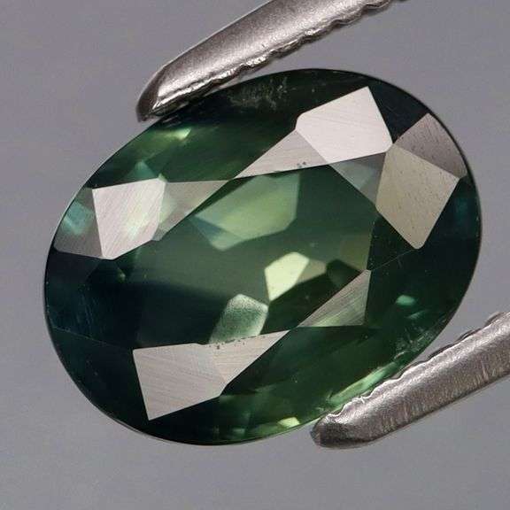 Real! 1.67ct VS grade bi-color dark sage and hunter green Sapphire! Heated only!