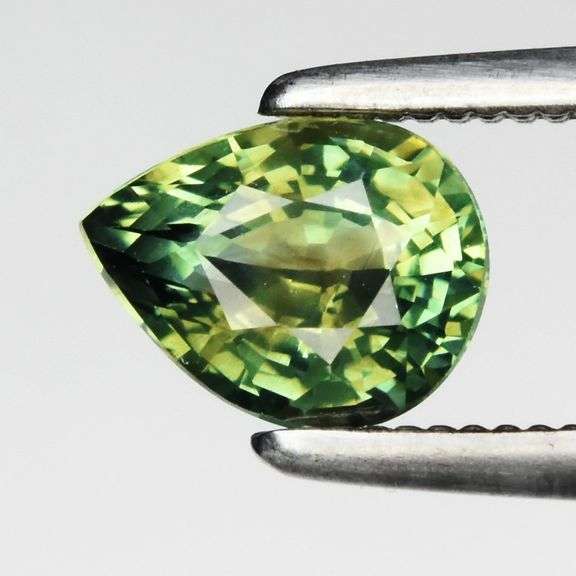 VS grade UNTREATED .83ct pear cut bright green Sapphire