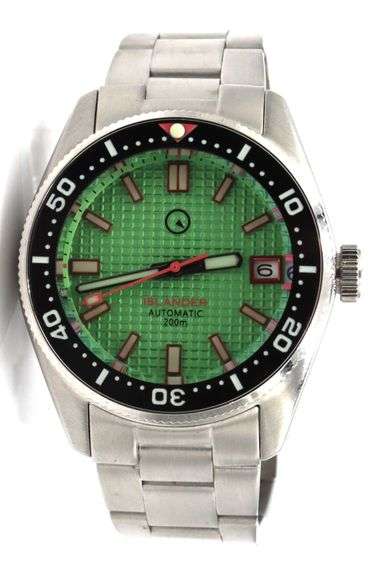 Islander automatic on Mint green waffle dial and coral red accents watch