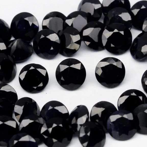 Heated Only! 5.70ct diamond cut black Sapphire set!