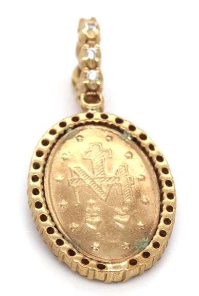 Nice 10K YG Miraculous Medal surrounded by Diamonds