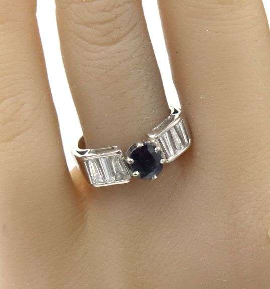 Blue sapphire and baguette diamond cocktail ring in Platinum