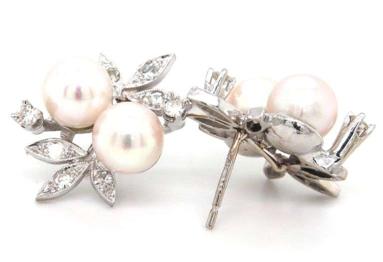 14kt White gold double pearl and diamond accent flower style earrings
