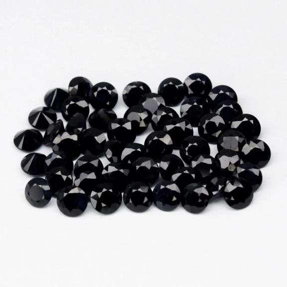 Heated Only! 5.70ct diamond cut black Sapphire set!