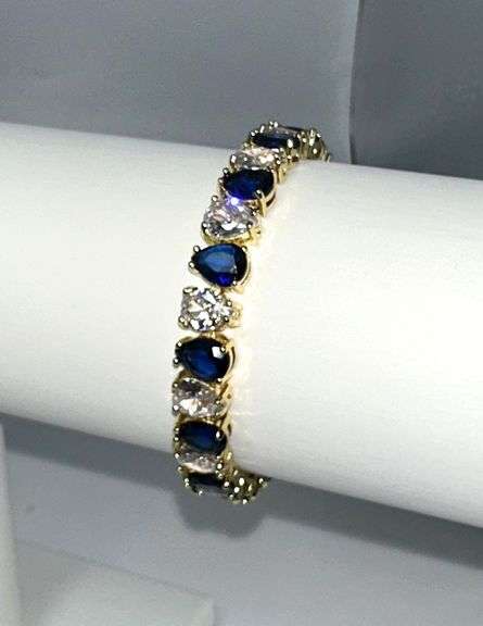 Stunning Yellow Gold Plated 32.5 Ctw Simulated Sapphire and CZ Tennis Bracelet