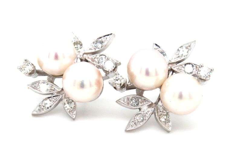14kt White gold double pearl and diamond accent flower style earrings