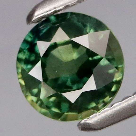 Simply gorgeous! VS grade .69ct yellow green Sapphire solitaire!