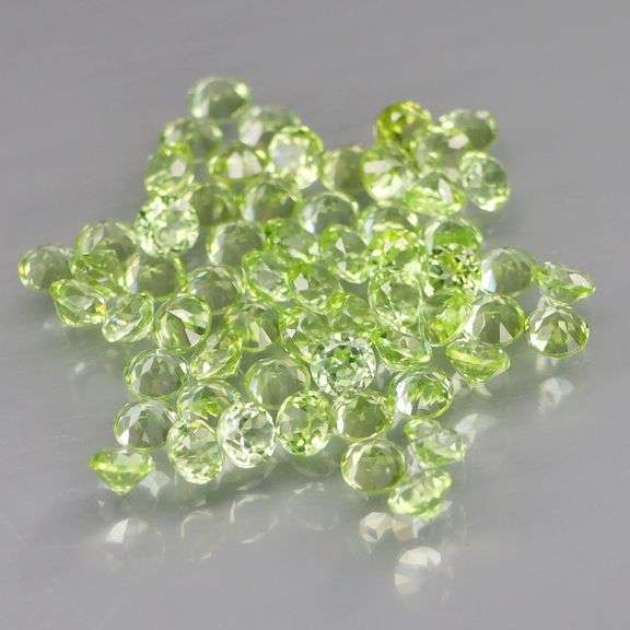 Dazzling 4.70ct untreated super clean apple green Peridot set