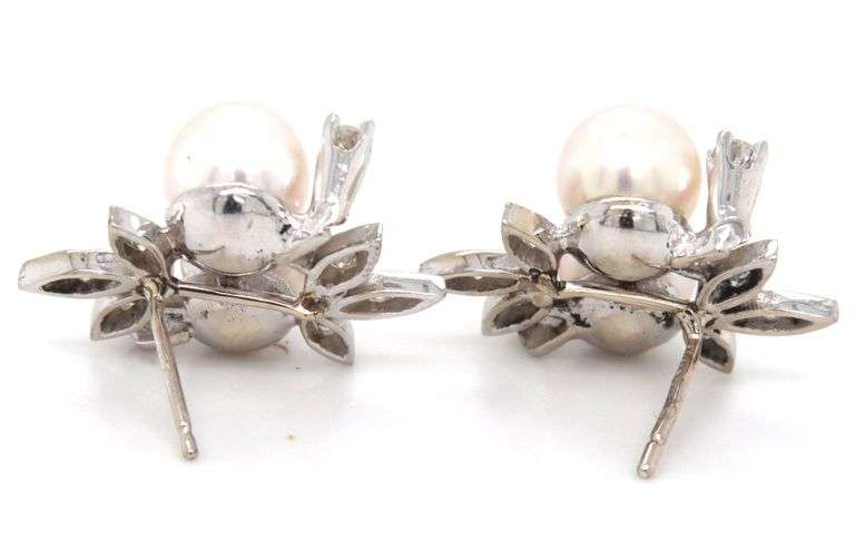 14kt White gold double pearl and diamond accent flower style earrings