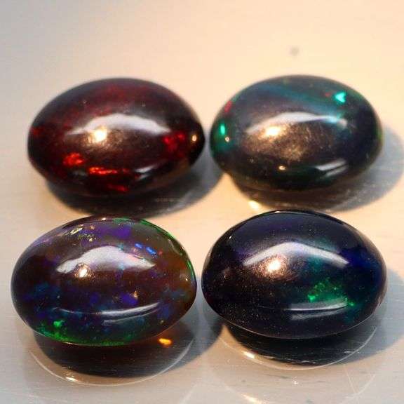 Silky black 3.35ct 4 piece Opal cabochon set!