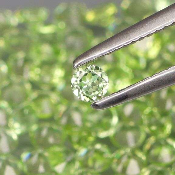 Dazzling 4.70ct untreated super clean apple green Peridot set