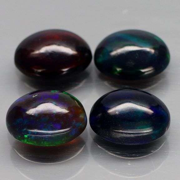 Silky black 3.35ct 4 piece Opal cabochon set!