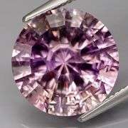 It’s an 8.40ct fully concave cut Amethyst solitaire in lilac and pink!