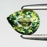 VS grade UNTREATED .83ct pear cut bright green Sapphire
