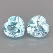 Dazzling 9.45ct vivid blue heart cut Topaz pair