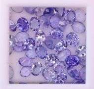 Heavy flashing! Untreated! 7.87ct oval cut Tanzanite set