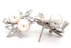14kt White gold double pearl and diamond accent flower style earrings