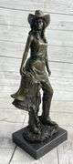 Hot Cast Cowgirl with Saddle Bronze Sculpture