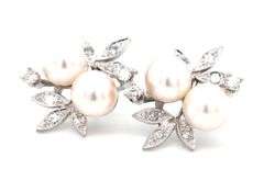 14kt White gold double pearl and diamond accent flower style earrings