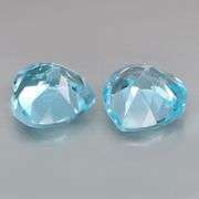Dazzling 9.45ct vivid blue heart cut Topaz pair