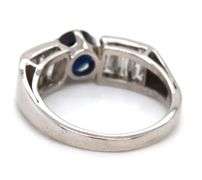 Blue sapphire and baguette diamond cocktail ring in Platinum