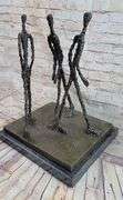 Three Walking Man Bronze Sculpture