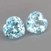Dazzling 9.45ct vivid blue heart cut Topaz pair