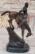 Chief Riding Horse on a Rock Bronze Sculpture