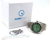 Islander automatic on Mint green waffle dial and coral red accents watch