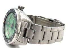 Islander automatic on Mint green waffle dial and coral red accents watch