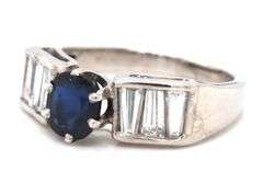 Blue sapphire and baguette diamond cocktail ring in Platinum