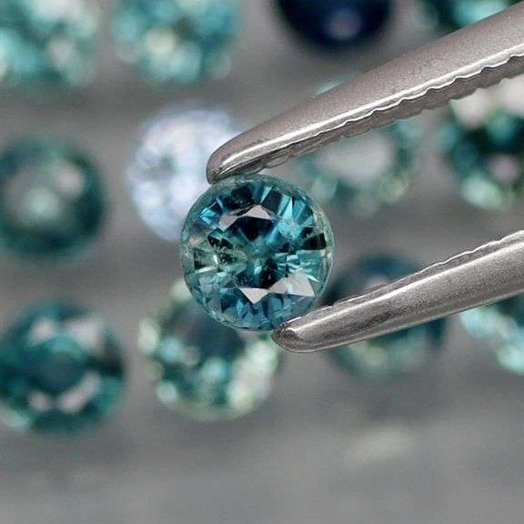 Heated only! 2.70ct blue green Sapphire set