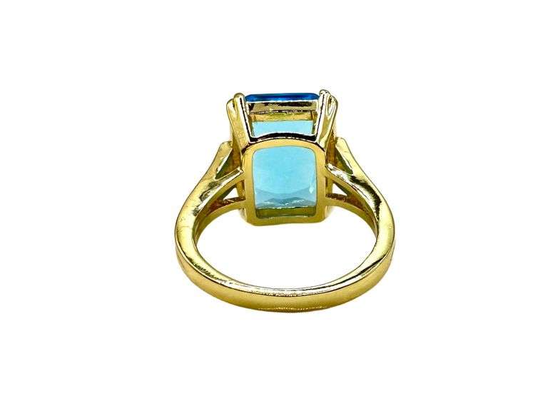 Breathtaking 14 kt Yellow Gold Plate 6.5 Ct Emerald Cut Simulated Swiss Blue Topaz Ring