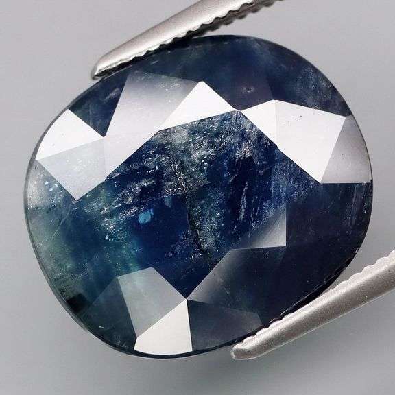Huge! Striated color! Silver sheen! 9.52ct natural Sapphire!