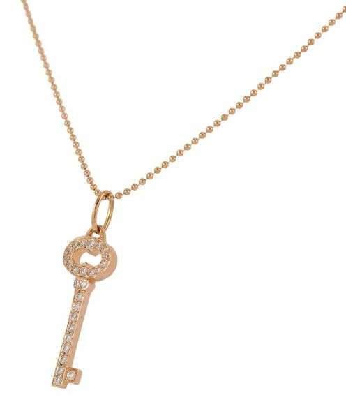 Tiffany & Co. 0.15ctw Diamond Vintage Oval Key Pendant Necklace in 18K