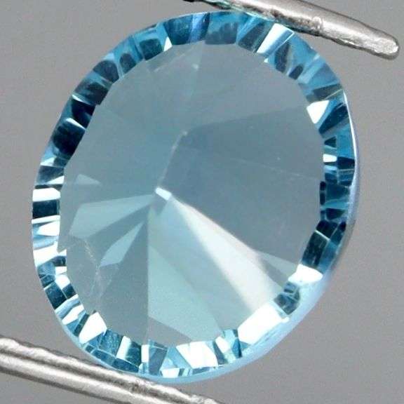 Fiery! Non-stop full body flashing 8.66ct concave cut Topaz!