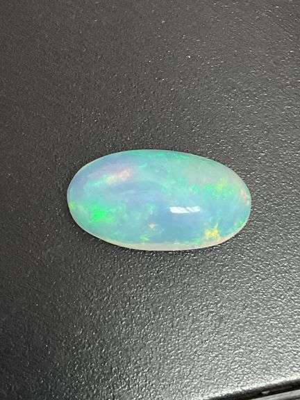 NATURAL OPAL LOOSE-7.48 CARATS OVAL CABOCHON CUT