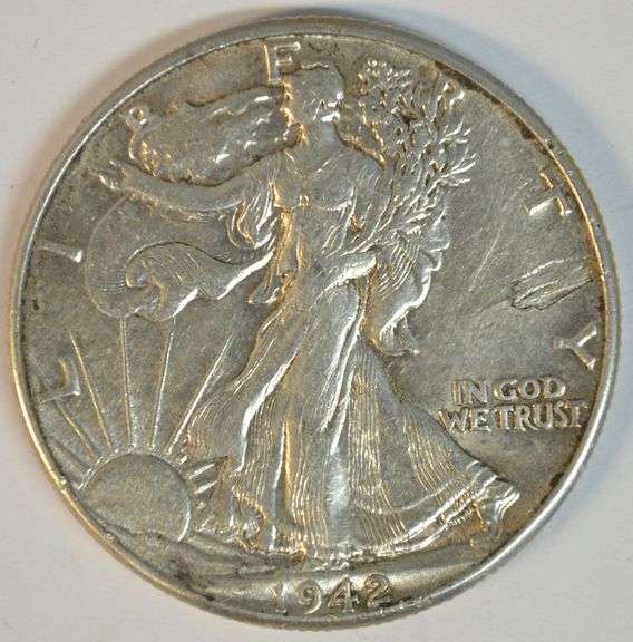 Upper end 1942 Walking Liberty Half Dollar with obverse lamination error