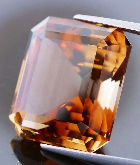 Electric flashing through rich color! Huge 34.99ct Imperial Topaz!