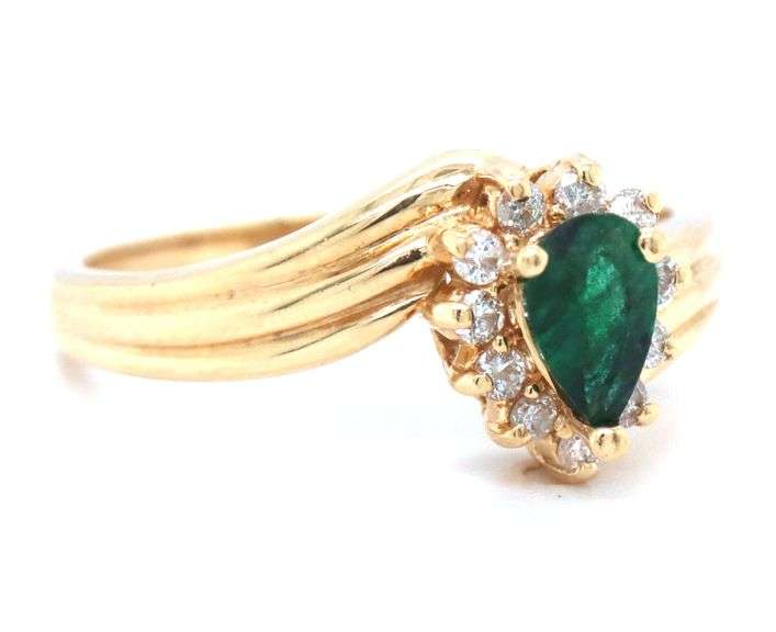 Feminine 14k Yellow Gold Ring with Pear Shaped Emerald