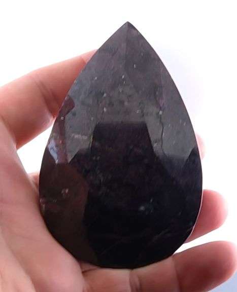 Holy cow! It's a 1,374ct Ruby in Matrix! With a stand!