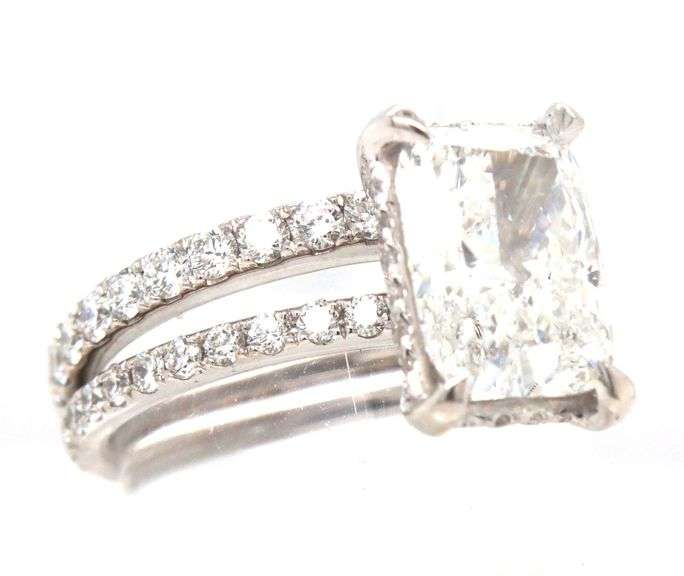 18kt White gold 2.55ct Cushion cut lab grown and 0.55ctw diamond under halo wedding set