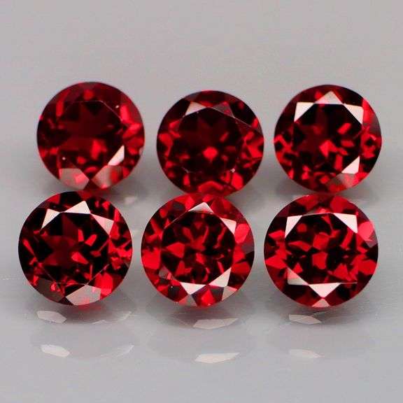 LOOK! It’s a whole set of Mozambique Garnet solitaires! 8.95 carats of them!