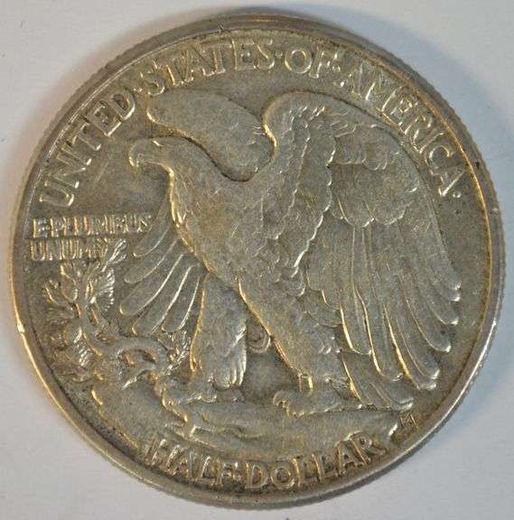 Upper end 1942 Walking Liberty Half Dollar with obverse lamination error