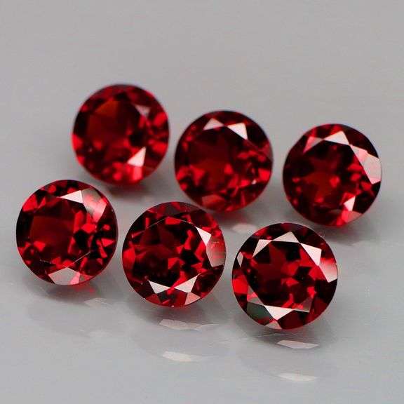 LOOK! It’s a whole set of Mozambique Garnet solitaires! 8.95 carats of them!